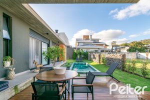 Casa em Condomínio à venda com 260m², 3 dormitórios, 3 suítes, 4 vagas, no bairro Alphaville em PORTO ALEGRE