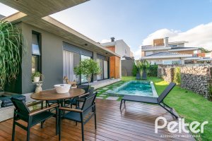 Casa em Condomínio à venda com 260m², 3 dormitórios, 3 suítes, 4 vagas, no bairro Alphaville em PORTO ALEGRE