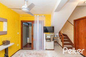 Casa em Condomínio à venda com 102m², 2 dormitórios, 1 suíte, 1 vaga, no bairro Guarujá em Porto Alegre