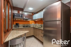 Casa em Condomínio à venda com 102m², 2 dormitórios, 1 suíte, 1 vaga, no bairro Guarujá em Porto Alegre