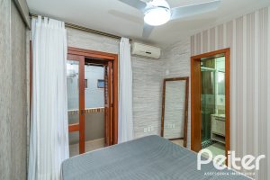 Casa em Condomínio à venda com 102m², 2 dormitórios, 1 suíte, 1 vaga, no bairro Guarujá em Porto Alegre