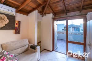 Casa em Condomínio à venda com 102m², 2 dormitórios, 1 suíte, 1 vaga, no bairro Guarujá em Porto Alegre