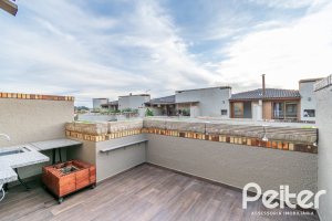 Casa em Condomínio à venda com 102m², 2 dormitórios, 1 suíte, 1 vaga, no bairro Guarujá em Porto Alegre