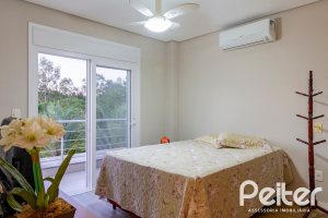 Casa em Condomínio à venda com 308m², 3 dormitórios, 3 suítes, 2 vagas, no bairro Alphaville em PORTO ALEGRE