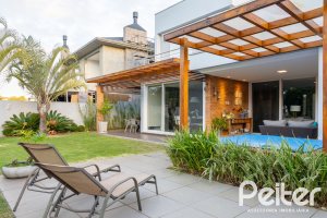 Casa em Condomínio à venda com 308m², 3 dormitórios, 3 suítes, 2 vagas, no bairro Alphaville em PORTO ALEGRE