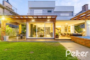 Casa em Condomínio à venda com 308m², 3 dormitórios, 3 suítes, 2 vagas, no bairro Alphaville em PORTO ALEGRE