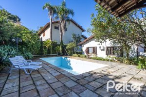 Casa em Condomínio à venda com 280m², 4 dormitórios, 2 suítes, 5 vagas, no bairro Cavalhada em PORTO ALEGRE