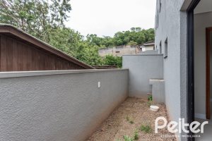 Casa em Condomínio à venda com 96m², 3 dormitórios, 1 suíte, 2 vagas, no bairro Tristeza em Porto Alegre