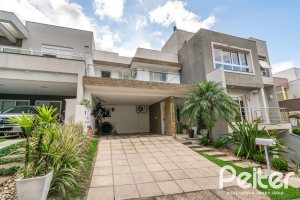 Casa em Condomínio à venda com 195m², 3 dormitórios, 1 suíte, 4 vagas, no bairro Vila Nova em Porto Alegre