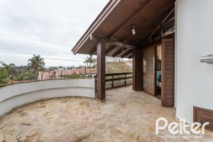 Casa à venda com 495m², 3 dormitórios, 2 suítes, 2 vagas, no bairro Jardim Isabel em Porto Alegre
