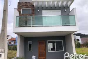 Casa à venda com 115m², 3 dormitórios, 1 suíte, 2 vagas, no bairro Hípica em Porto Alegre