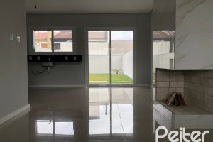 Casa à venda com 115m², 3 dormitórios, 1 suíte, 2 vagas, no bairro Hípica em Porto Alegre