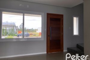 Casa à venda com 115m², 3 dormitórios, 1 suíte, 2 vagas, no bairro Hípica em Porto Alegre