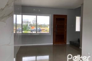 Casa à venda com 115m², 3 dormitórios, 1 suíte, 2 vagas, no bairro Hípica em Porto Alegre