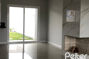 Casa à venda com 115m², 3 dormitórios, 1 suíte, 2 vagas, no bairro Hípica em Porto Alegre