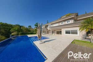 Casa em Condomínio à venda com 1400m², 5 dormitórios, 4 suítes, 10 vagas, no bairro Cavalhada em PORTO ALEGRE