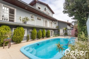 Casa à venda com 334m², 4 dormitórios, 2 suítes, 4 vagas, no bairro Jardim Isabel em Porto Alegre