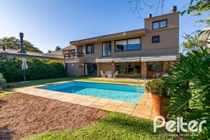 Casa em Condomínio à venda com 315m², 3 dormitórios, 3 suítes, 4 vagas, no bairro Cavalhada em PORTO ALEGRE