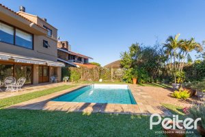 Casa em Condomínio à venda com 315m², 3 dormitórios, 3 suítes, 4 vagas, no bairro Cavalhada em PORTO ALEGRE