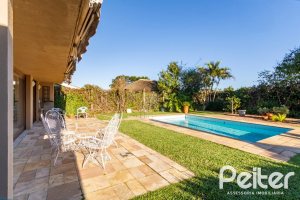 Casa em Condomínio à venda com 315m², 3 dormitórios, 3 suítes, 4 vagas, no bairro Cavalhada em PORTO ALEGRE