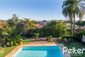 Casa em Condomínio à venda com 315m², 3 dormitórios, 3 suítes, 4 vagas, no bairro Cavalhada em PORTO ALEGRE