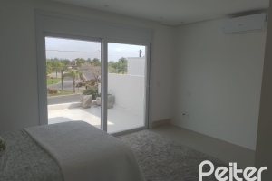Casa em Condomínio à venda com 349m², 5 dormitórios, 5 suítes, 4 vagas, no bairro Terra Ville em PORTO ALEGRE