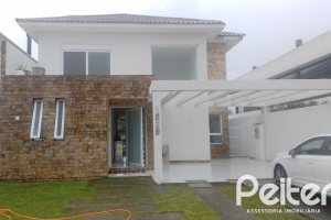 Casa em Condomínio à venda com 349m², 5 dormitórios, 5 suítes, 4 vagas, no bairro Terra Ville em PORTO ALEGRE