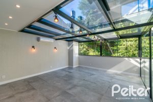 Casa em Condomínio à venda com 248m², 3 dormitórios, 2 suítes, 2 vagas, no bairro Vila Nova em Porto Alegre