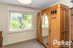 Casa em Condomínio à venda com 293m², 3 dormitórios, 1 suíte, 2 vagas, no bairro Tristeza em Porto Alegre