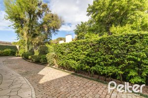 Casa em Condomínio à venda com 293m², 3 dormitórios, 1 suíte, 2 vagas, no bairro Tristeza em Porto Alegre