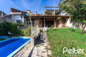 Casa à venda com 280m², 3 dormitórios, 1 suíte, 4 vagas, no bairro Tristeza em Porto Alegre