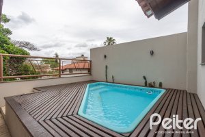 Casa em Condomínio à venda com 340m², 3 dormitórios, 1 suíte, 2 vagas, no bairro Jardim Isabel em Porto Alegre