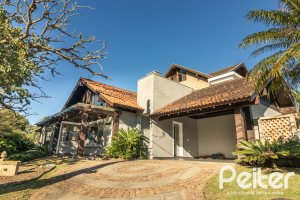 Casa em Condomínio à venda com 196m², 3 dormitórios, 1 suíte, 4 vagas, no bairro Terra Ville em PORTO ALEGRE