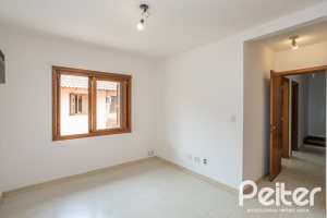 Casa em Condomínio à venda com 132m², 3 dormitórios, 1 suíte, 2 vagas, no bairro Guarujá em Porto Alegre