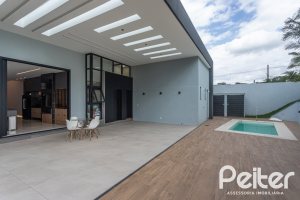 Casa em Condomínio à venda com 303m², 4 dormitórios, 4 suítes, 4 vagas, no bairro Alphaville em PORTO ALEGRE