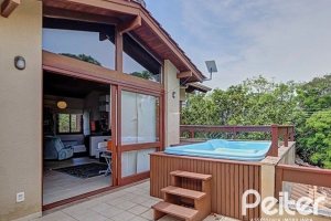 Casa em Condomínio à venda com 338m², 3 dormitórios, 1 suíte, 2 vagas, no bairro Tristeza em PORTO ALEGRE