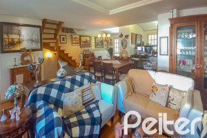 Casa em Condomínio à venda com 259m², 3 dormitórios, 1 suíte, 3 vagas, no bairro Vila Nova em Porto Alegre