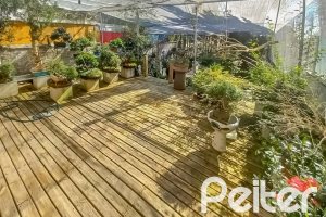 Casa em Condomínio à venda com 259m², 3 dormitórios, 1 suíte, 3 vagas, no bairro Vila Nova em Porto Alegre