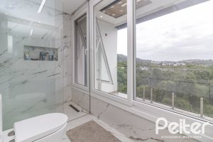 Casa em Condomínio à venda com 309m², 3 dormitórios, 2 suítes, 4 vagas, no bairro Alphaville em PORTO ALEGRE