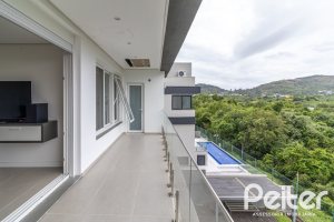 Casa em Condomínio à venda com 309m², 3 dormitórios, 2 suítes, 4 vagas, no bairro Alphaville em PORTO ALEGRE