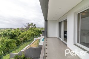 Casa em Condomínio à venda com 309m², 3 dormitórios, 2 suítes, 4 vagas, no bairro Alphaville em PORTO ALEGRE