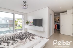 Casa em Condomínio à venda com 309m², 3 dormitórios, 2 suítes, 4 vagas, no bairro Alphaville em PORTO ALEGRE