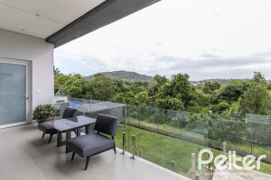 Casa em Condomínio à venda com 309m², 3 dormitórios, 2 suítes, 4 vagas, no bairro Alphaville em PORTO ALEGRE