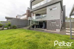 Casa em Condomínio à venda com 309m², 3 dormitórios, 2 suítes, 4 vagas, no bairro Alphaville em PORTO ALEGRE
