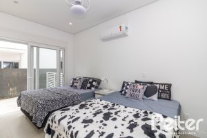 Casa em Condomínio à venda com 309m², 3 dormitórios, 2 suítes, 4 vagas, no bairro Alphaville em PORTO ALEGRE