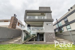 Casa em Condomínio à venda com 309m², 3 dormitórios, 2 suítes, 4 vagas, no bairro Alphaville em PORTO ALEGRE