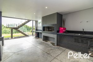 Casa em Condomínio à venda com 309m², 3 dormitórios, 2 suítes, 4 vagas, no bairro Alphaville em PORTO ALEGRE