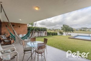 Casa em Condomínio à venda com 336m², 4 dormitórios, 4 suítes, 4 vagas, no bairro Terra Ville em PORTO ALEGRE