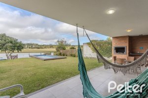 Casa em Condomínio à venda com 336m², 4 dormitórios, 4 suítes, 4 vagas, no bairro Terra Ville em PORTO ALEGRE