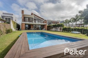 Casa em Condomínio à venda com 336m², 4 dormitórios, 4 suítes, 4 vagas, no bairro Terra Ville em PORTO ALEGRE